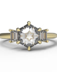 Close up of the Three Stone Alice Solitaire Engagement Ring in yellow gold by Fluid Jewellery