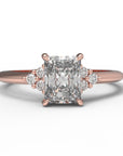 Close up of the Cluster Aria Solitaire Engagement Ring in rose gold by Fluid Jewellery