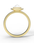 Close up of the Halo Aura Solitaire Engagement Ring in yellow gold by Fluid Jewellery 3