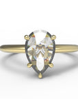 Close up of the Avery Solitaire Engagement Ring in yellow gold by Fluid Jewellery