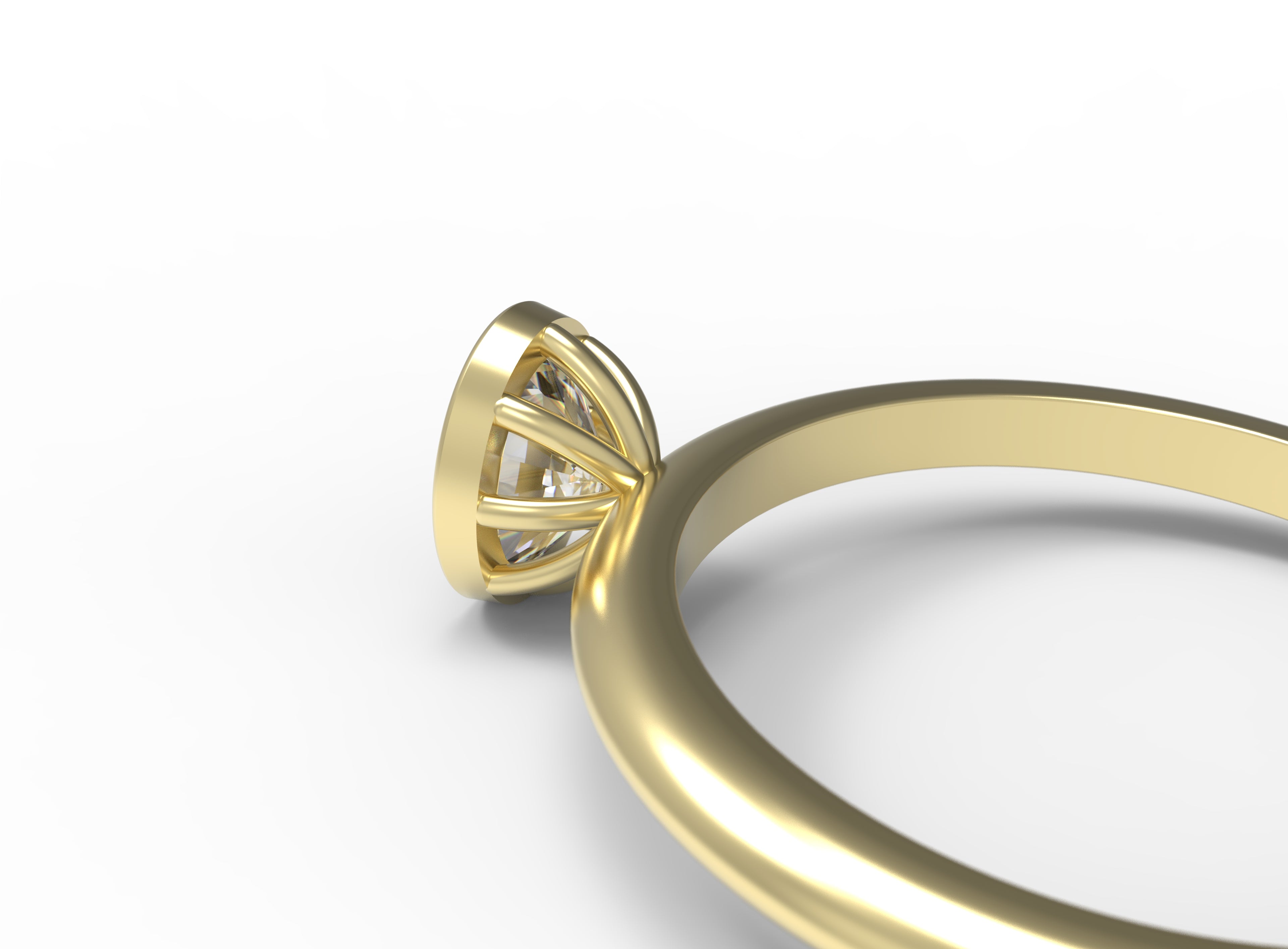 Close up of the Bezel Isla Solitaire Engagement Ring in yellow gold by Fluid Jewellery 5