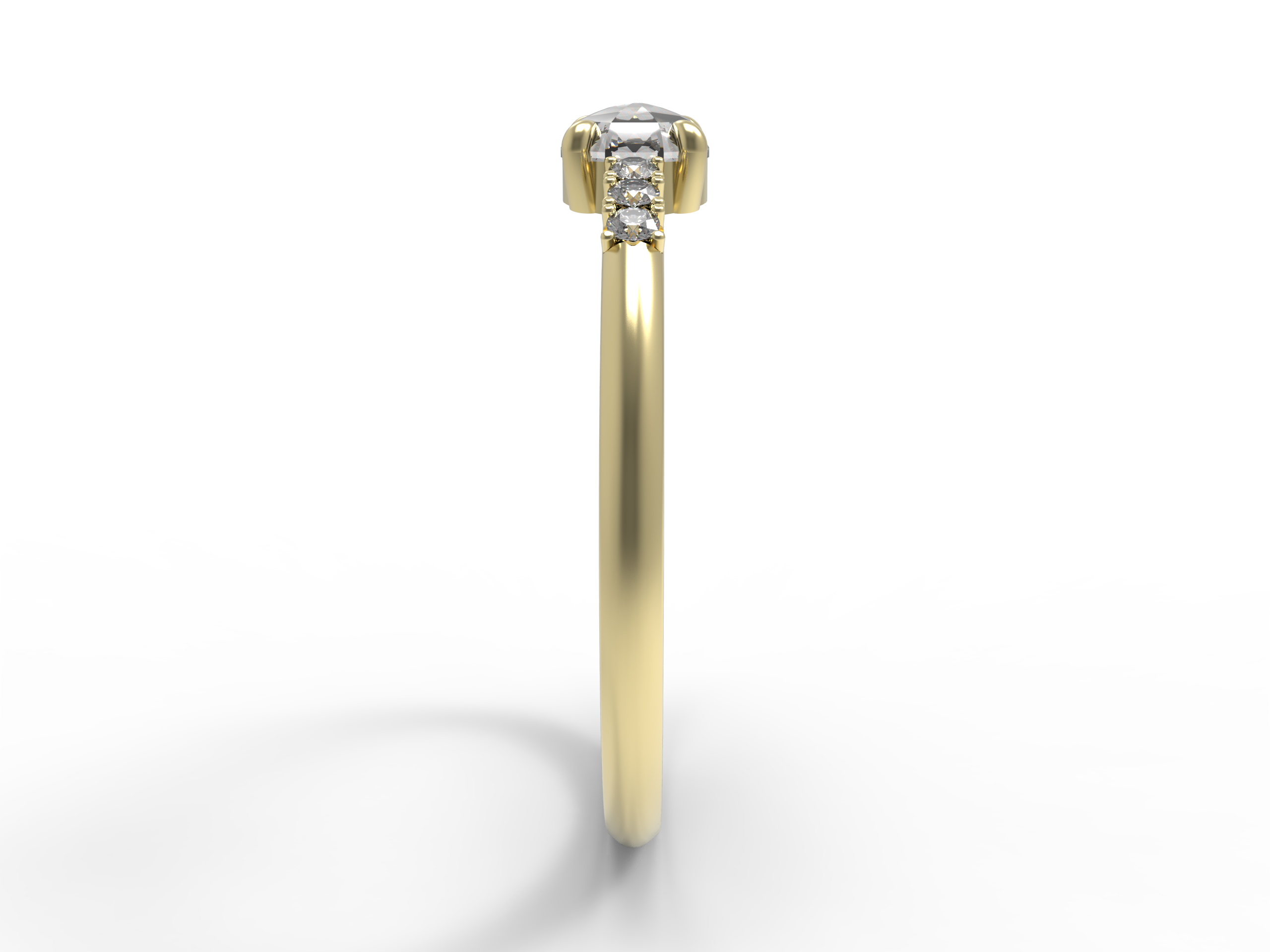 Close up of the Accented Bri Solitaire Engagement Ring in yellow gold by Fluid Jewellery2