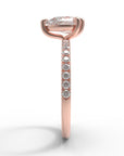 Close up of the Accented Edith Solitaire Engagement Ring in rose gold by Fluid Jewellery 3