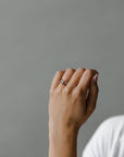 Model wearing the Classic Ivy Engagement Ring in gold by Fluid Jewellery 3