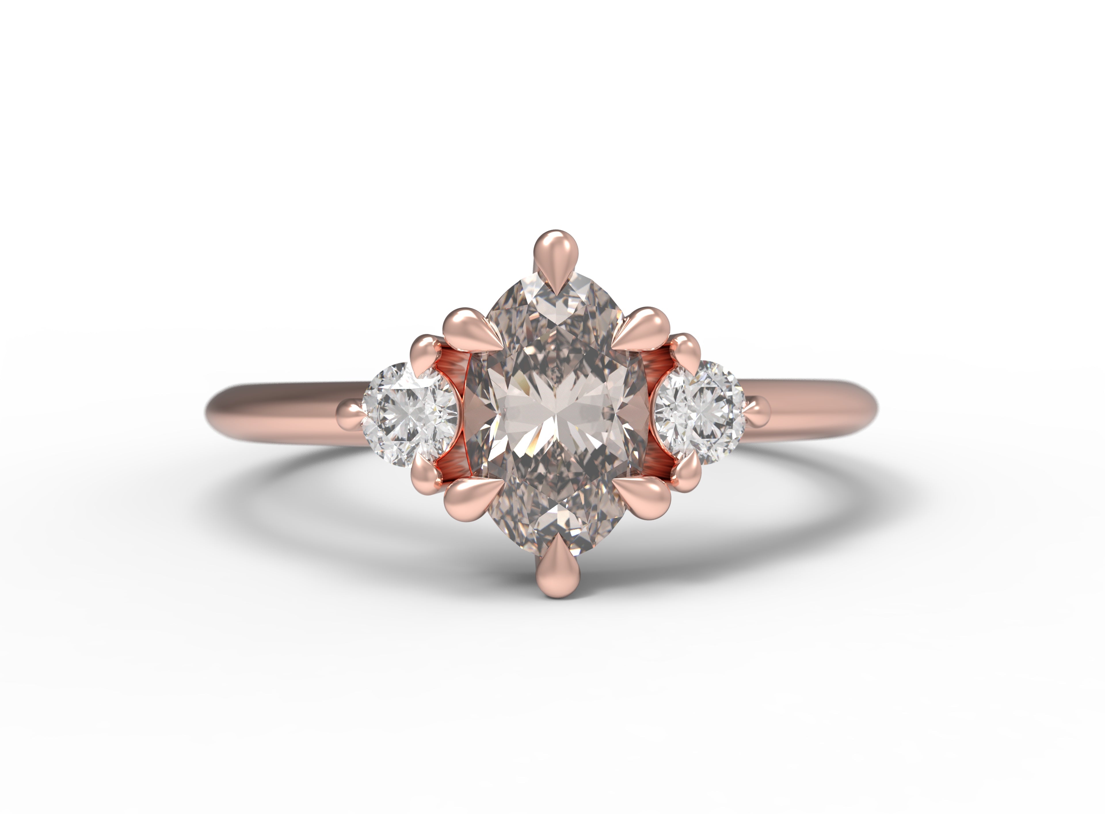 Close up of the Three Stone Rebecca Solitaire Engagement Ring in rose gold by Fluid Jewellery