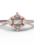 Close up of the Three Stone Rebecca Solitaire Engagement Ring in rose gold by Fluid Jewellery