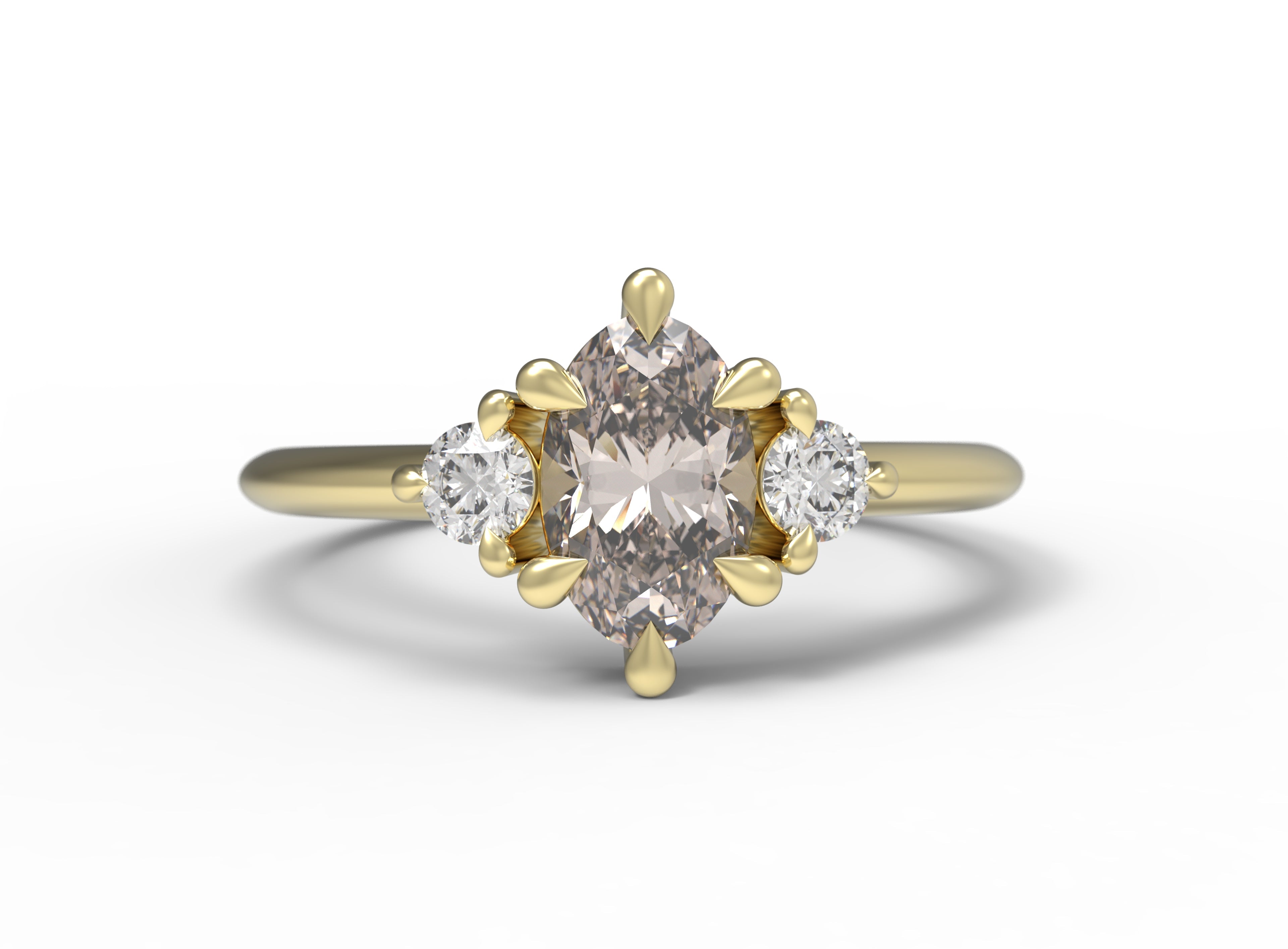 Close up of the Three Stone Rebecca Solitaire Engagement Ring in yellow gold by Fluid Jewellery