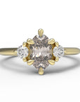 Close up of the Three Stone Rebecca Solitaire Engagement Ring in yellow gold by Fluid Jewellery