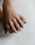 Model wearing the Classic Sula Solitaire Engagement Ring in gold by Fluid Jewellery 3