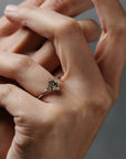 Rebecca three stone engagement ring featuring a champagne toned move cut diamond accented by white full cut diamonds.