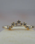 Snowflake curved gold wedding band featuring Canadian diamonds in a a snowflake inspired design.