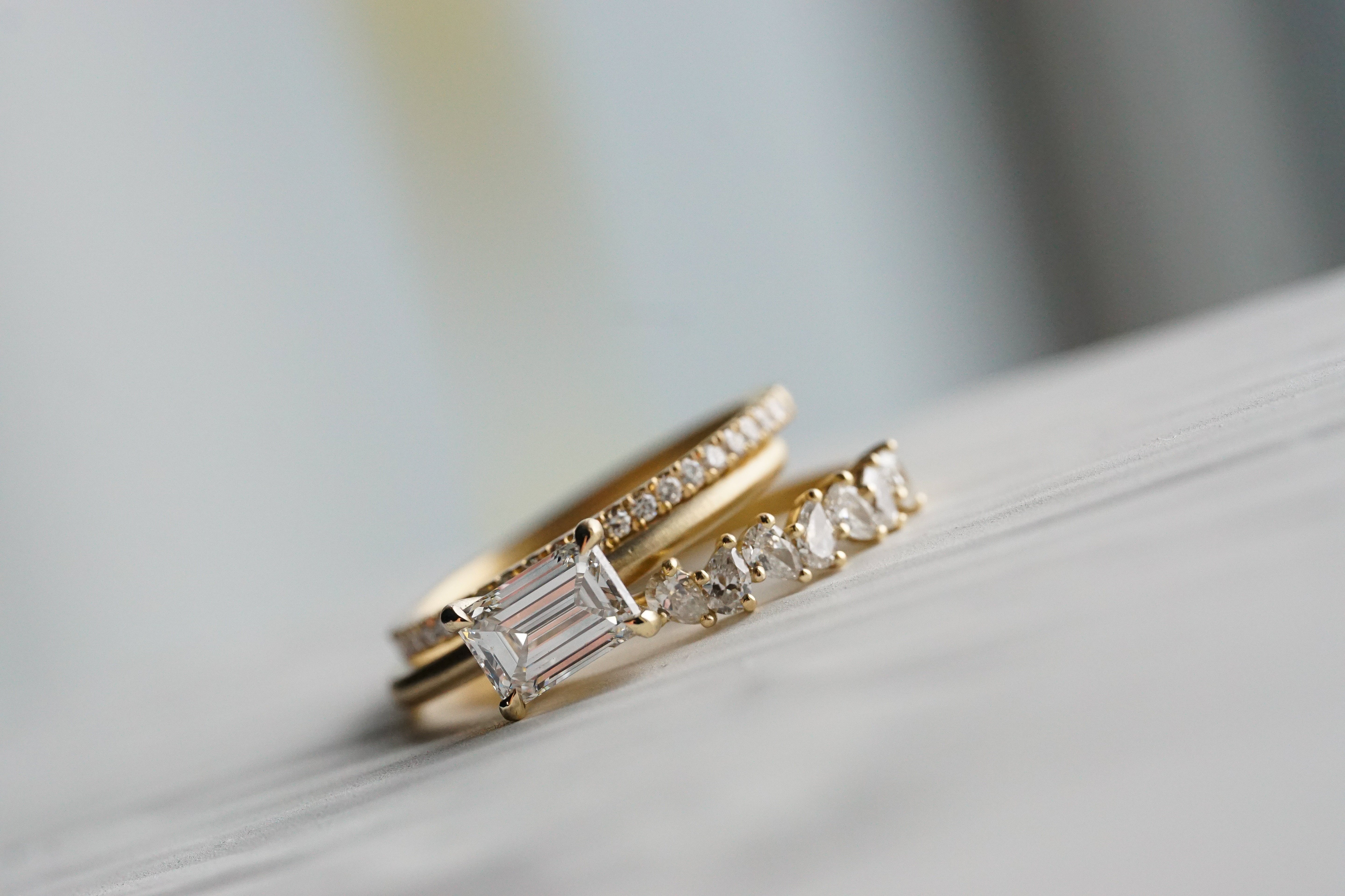 Close up of thecluster Maeve womens wedding band by Fluid Jewellery in yellow gold 5