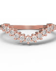 Close up of the curved Ida womens wedding band by Fluid Jewellery in rose gold