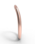 Close up of the curved flow womens wedding band by Fluid Jewellery in rose gold 2