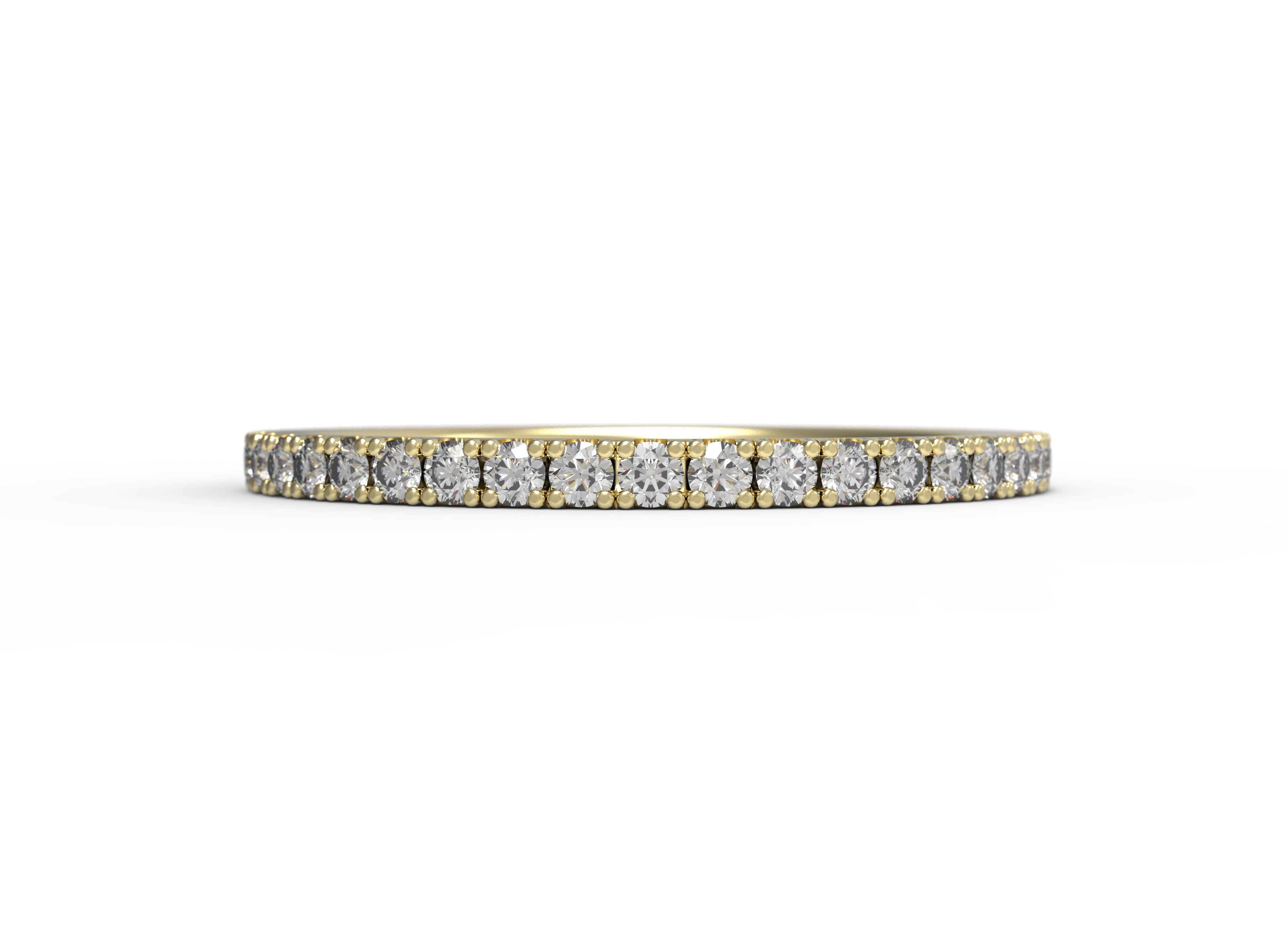 Close up of the classic Eternity womens wedding band by Fluid Jewellery in yellow gold