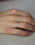 Close up of model hand wearing the Pave Jane womens wedding band by Fluid Jewellery in gold