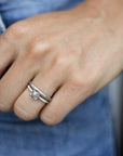 Close up of model hand wearing the Starlight womens wedding band by Fluid Jewellery in gold