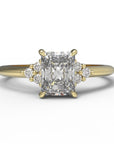 Close up of the Cluster Aria Solitaire Engagement Ring in yellow gold by Fluid Jewellery