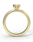 Close up of the Bezel Isla Solitaire Engagement Ring in yellow gold by Fluid Jewellery 3