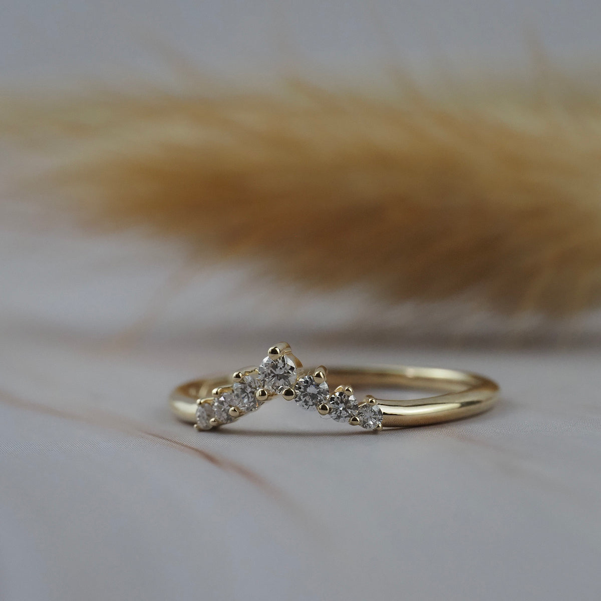 Claudia chevron wedding band in Fairmined gold featuring delicate Canadian diamonds. 