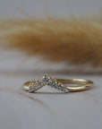 Claudia chevron wedding band in Fairmined gold featuring delicate Canadian diamonds. 