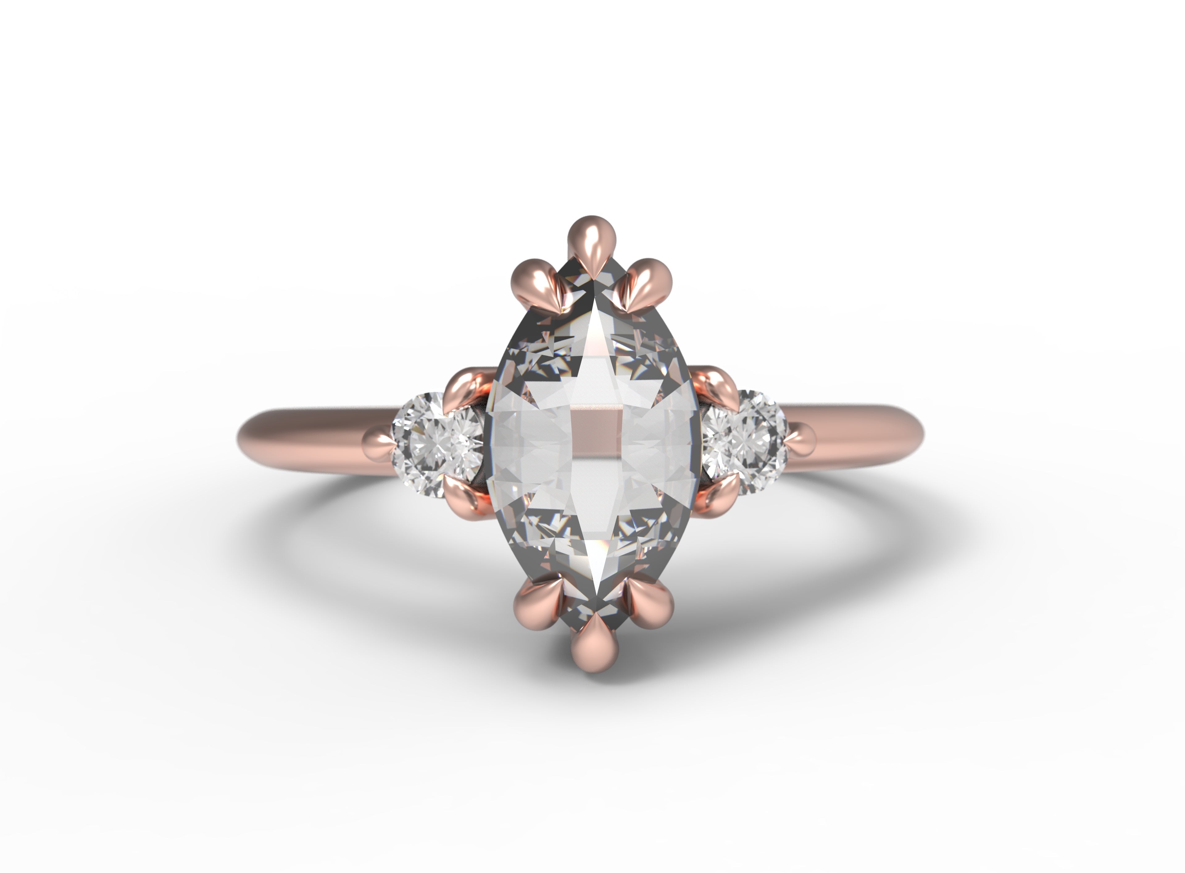 Close up of the Three Stone Elizabeth Engagement Ring in rose gold by Fluid Jewellery