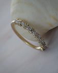 Marissa cluster wedding band featuring round and marquise shaped diamonds in handcrafted gold setting.