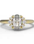 Close up of the Cluster Matilda Solitaire Engagement Ring in yellow gold by Fluid Jewellery