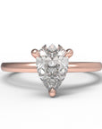 Close up of the Classic Sula Solitaire Engagement Ring in rose gold by Fluid Jewellery