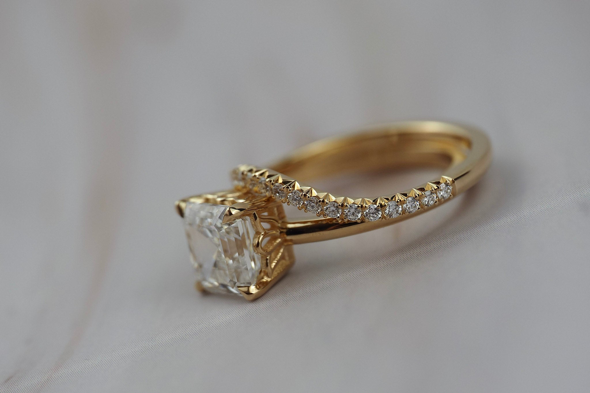 Asscher cut diamond claw solitaire paired with the Pernelle curved French pave diamond wedding band. 