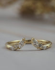 Aster open guard diamond wedding band in Fairmined gold featuring marquise and round diamonds in flower inspired design.