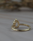 Back view of the Avery pear shaped rose cut diamond solitaire engagement ring showing the gold setting.
