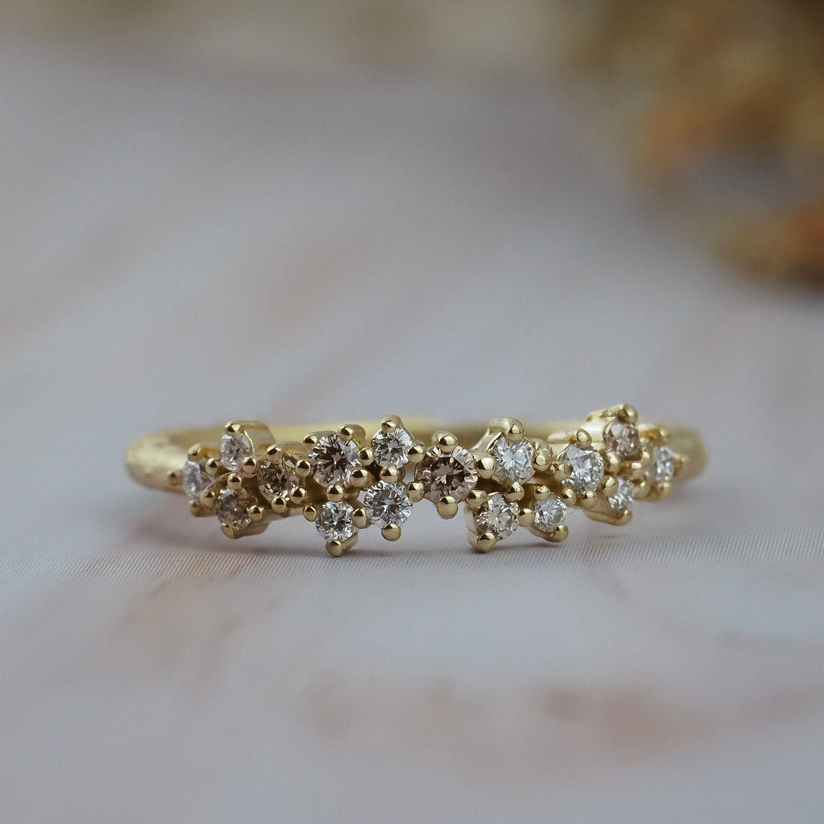 Constellation diamond wedding band in gold featuring delicate diamonds in a scattered star-inspired design.