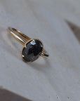 Elanor salt and pepper oval diamond six-claw solitaire with an Art Deco woven basket setting and migrained edge.