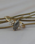 Close-up detail of the Meghan salt and pepper marquise shaped rose cut cluster engagement ring showing its handcrafted gold setting.