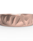 Close up of the mens Wave wedding band in rose gold