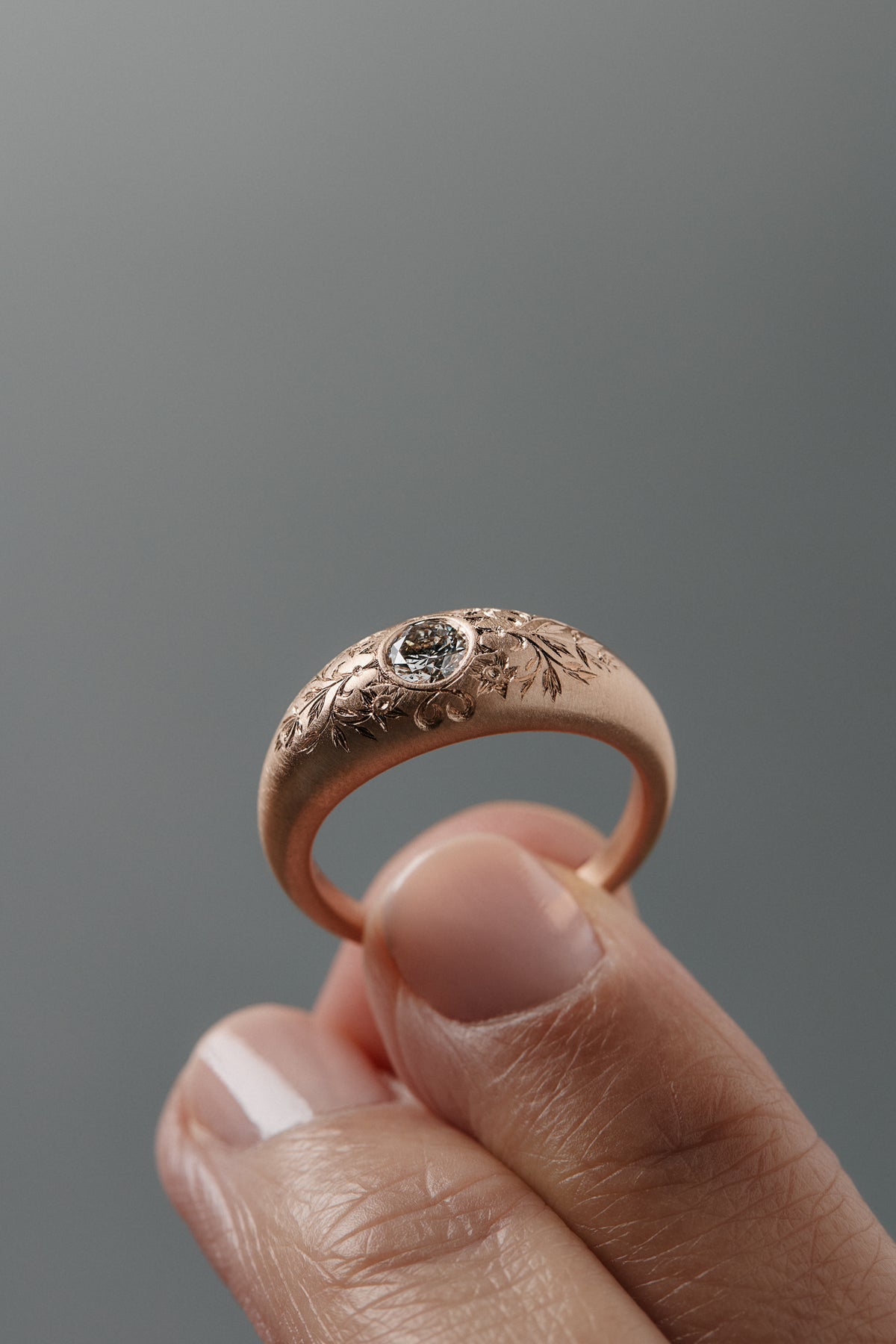 Mrs. Erykah hand-engraved floral bomb engagement ring in Fairmiend gold featuring a Canadian diamond, inspired by Erykah Badu.