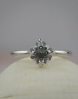 Myra compass platinum claw solitaire engagement ring featuring an Old European cut diamond.
