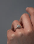 Close-up video of a women wearing the Myra compass platinum claw solitaire engagement ring with an Old European cut diamond.