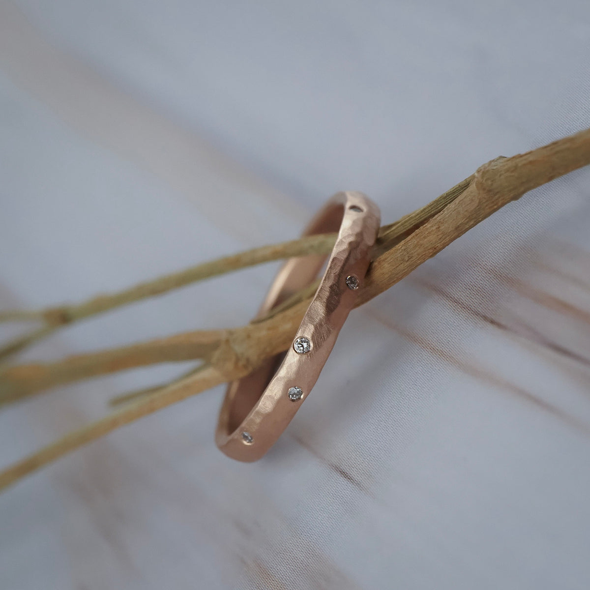 Starlight Fairmined gold wedding band featuring a hammered texture finish and Canadian diamonds.