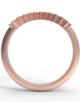Close up of the curved Ida womens wedding band by Fluid Jewellery in rose gold 3